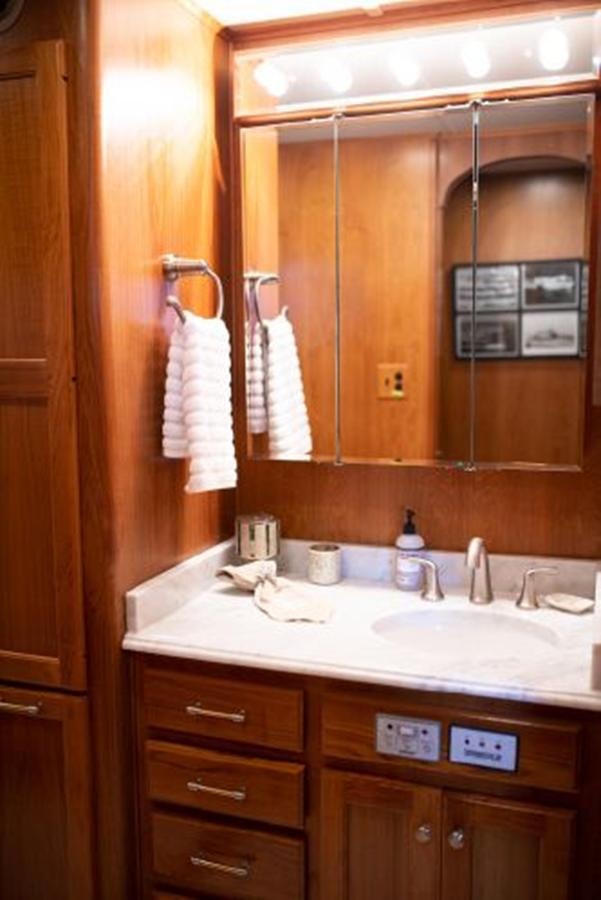 a bathroom with a sink and a mirror aboard 88 LAZY DAYS BEACHEM Yacht for Sale