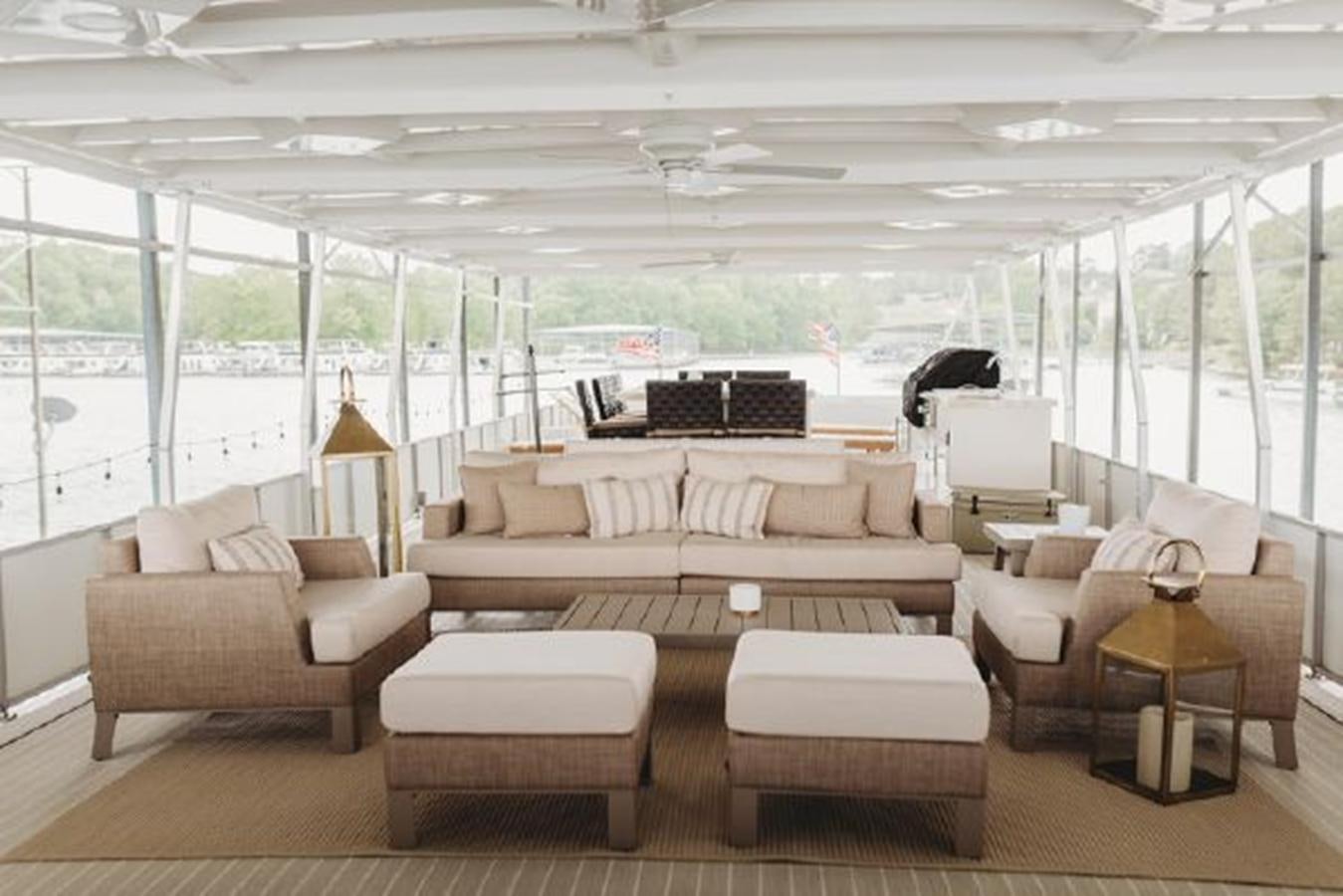 a living room with a large window aboard 88 LAZY DAYS BEACHEM Yacht for Sale