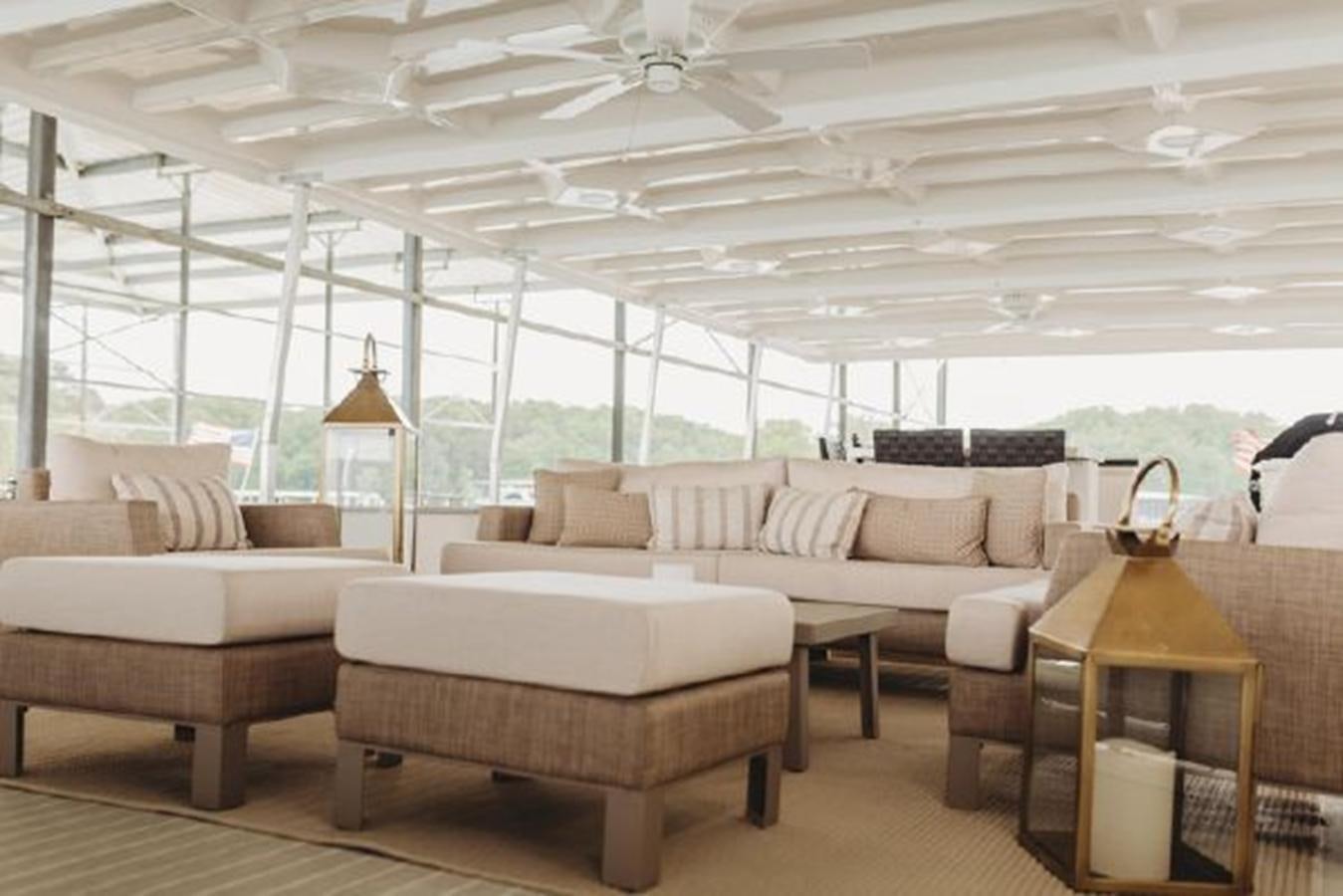 a living room with a large glass ceiling aboard 88 LAZY DAYS BEACHEM Yacht for Sale