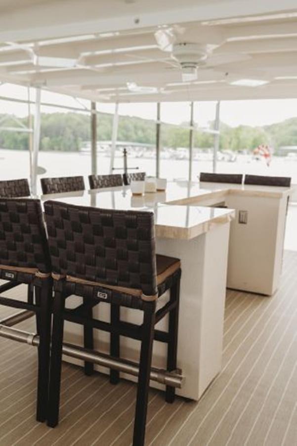 a room with a table and chairs aboard 88 LAZY DAYS BEACHEM Yacht for Sale