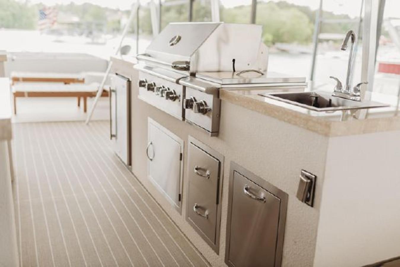 a kitchen with a sink and stove aboard 88 LAZY DAYS BEACHEM Yacht for Sale
