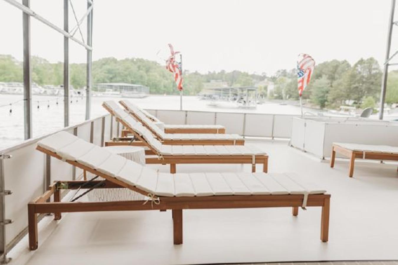 a bench sits unoccupied aboard 88 LAZY DAYS BEACHEM Yacht for Sale