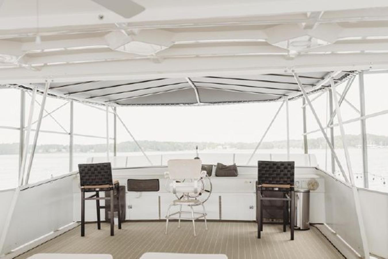 a room with a table and chairs aboard 88 LAZY DAYS BEACHEM Yacht for Sale