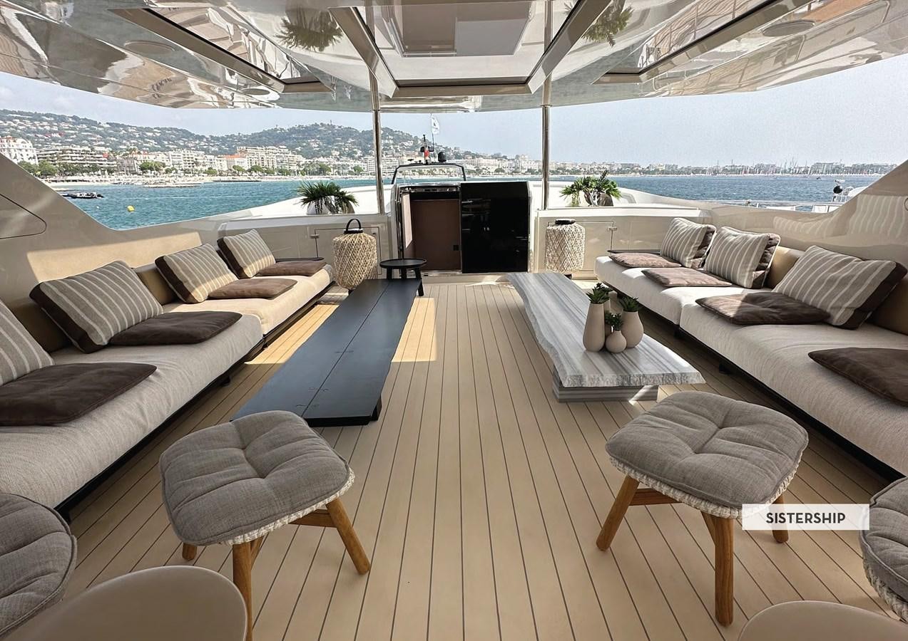 a living room with a large patio aboard 112DS MAZU Yacht for Sale