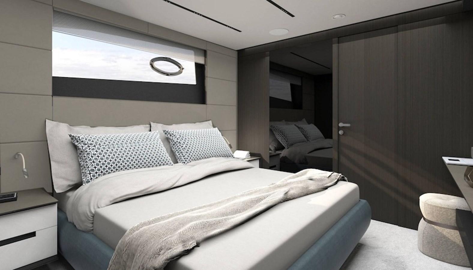 a room with a bed and a desk aboard PERSHING GTX 116 Yacht for Sale