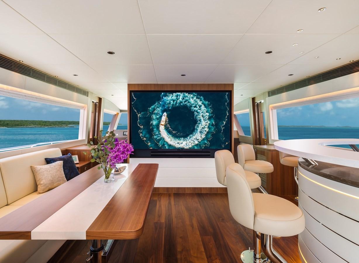 a room with a large painting aboard HORIZON FD110 Yacht for Sale
