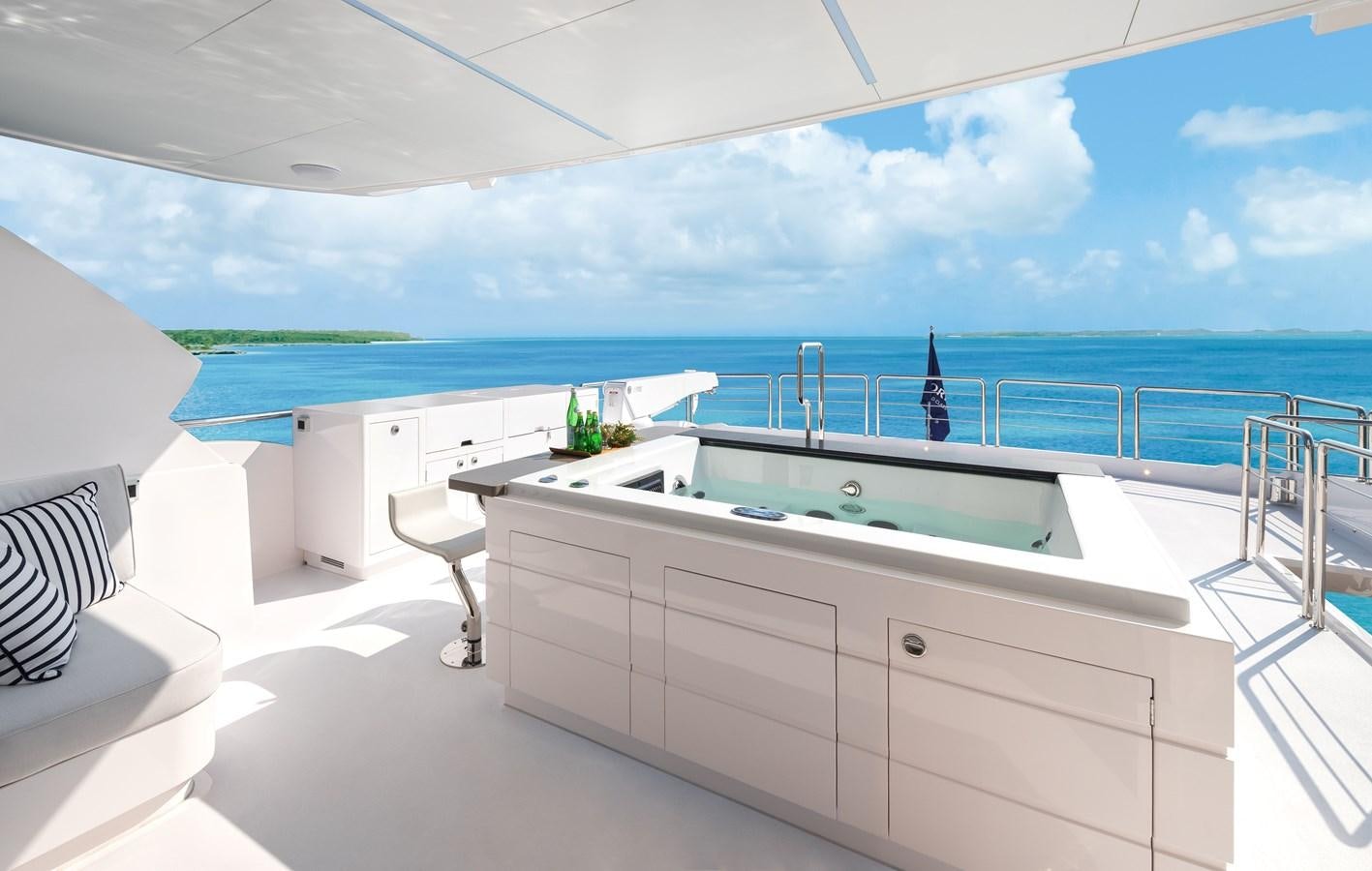 a large white room with a pool aboard HORIZON FD110 Yacht for Sale