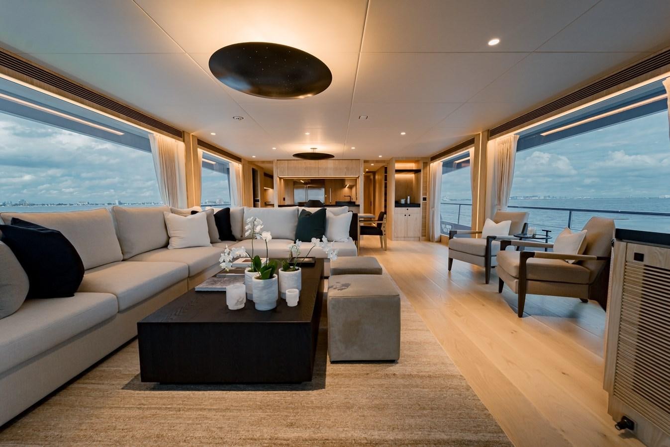 a living room with a large window aboard HORIZON FD110 Yacht for Sale