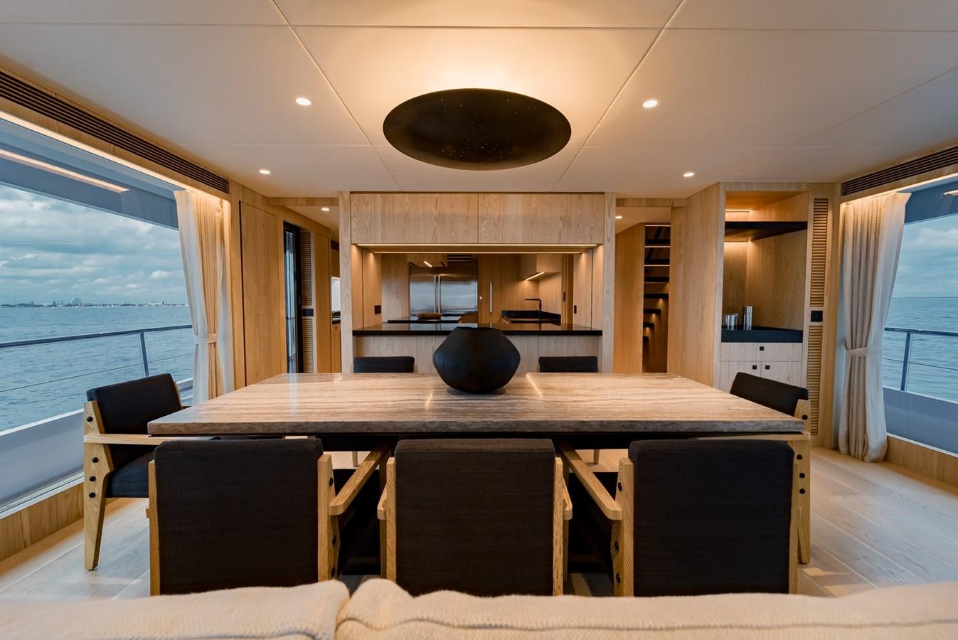 a large kitchen with a large island aboard HORIZON FD110 Yacht for Sale