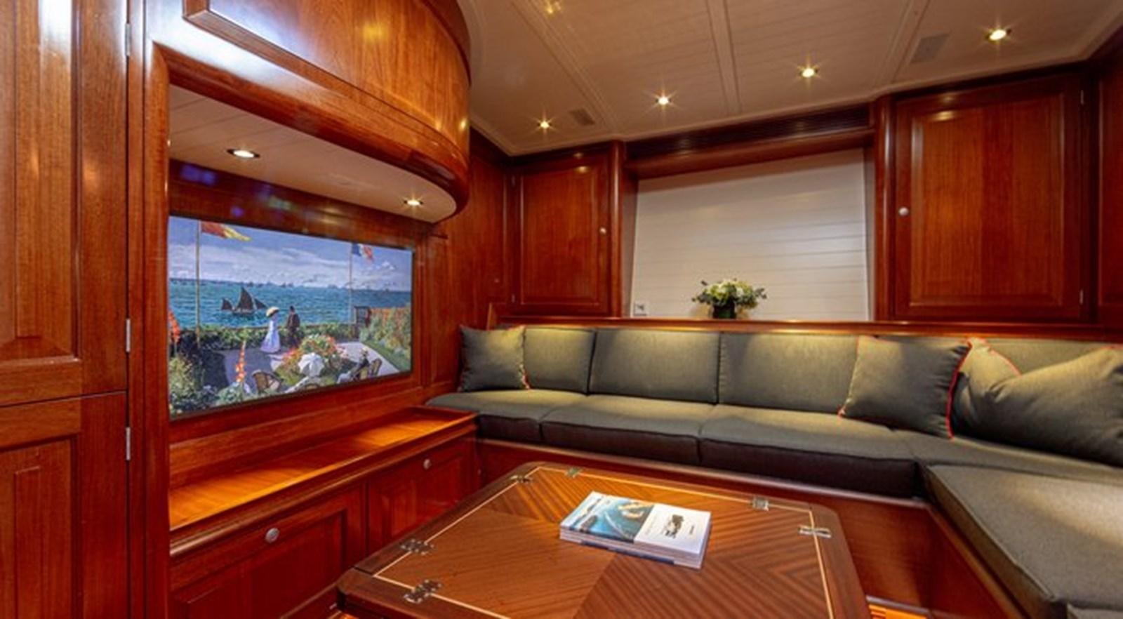a living room with a couch and a table aboard ATALANTE Yacht for Sale