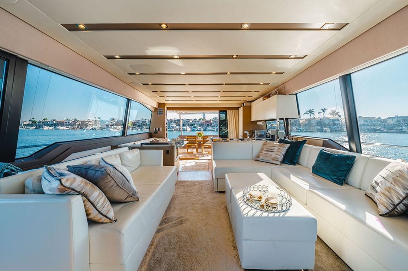 a living room with a large window aboard 2018 PRESTIGE 680 Yacht for Sale