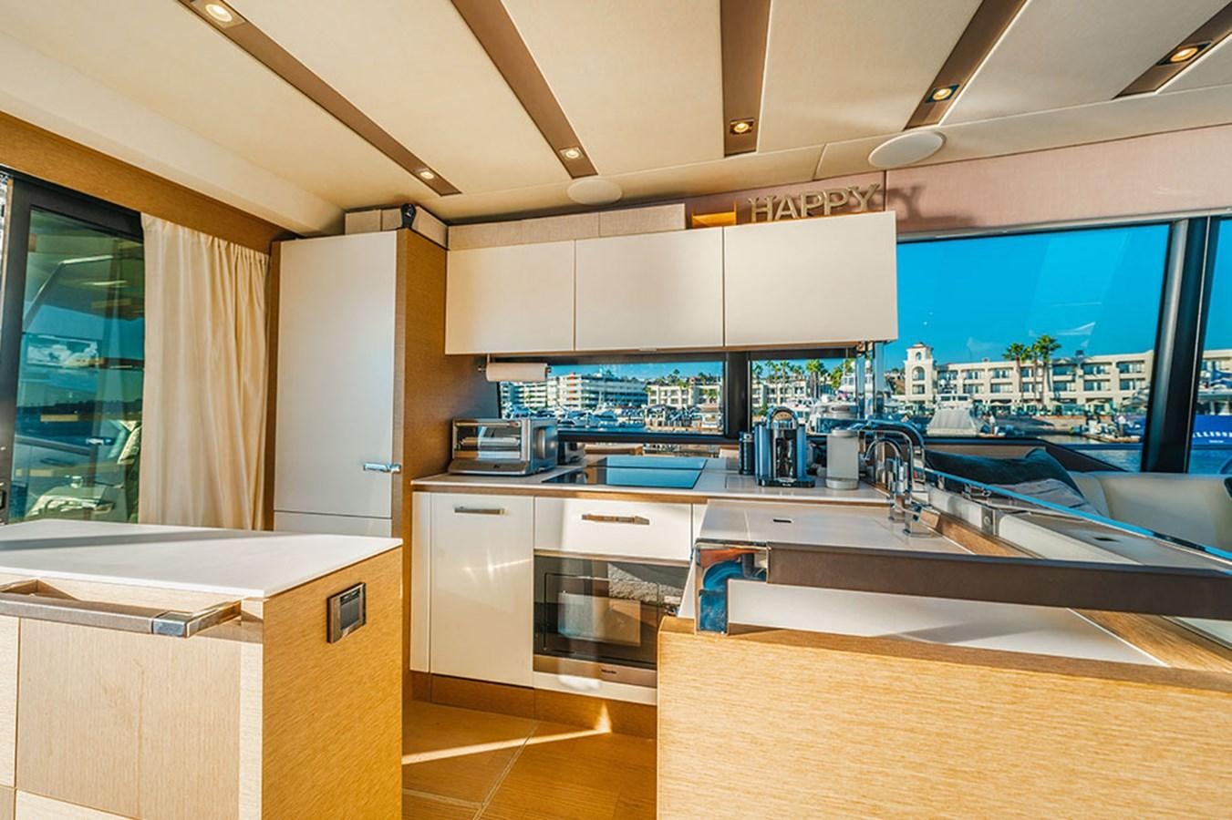 a kitchen with a large window aboard 2018 PRESTIGE 680 Yacht for Sale