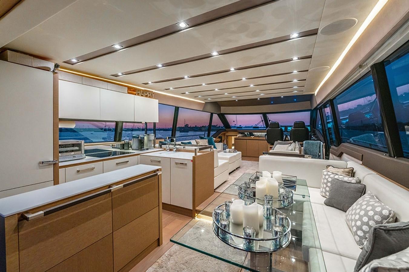 a room with a large table and chairs aboard 2018 PRESTIGE 680 Yacht for Sale