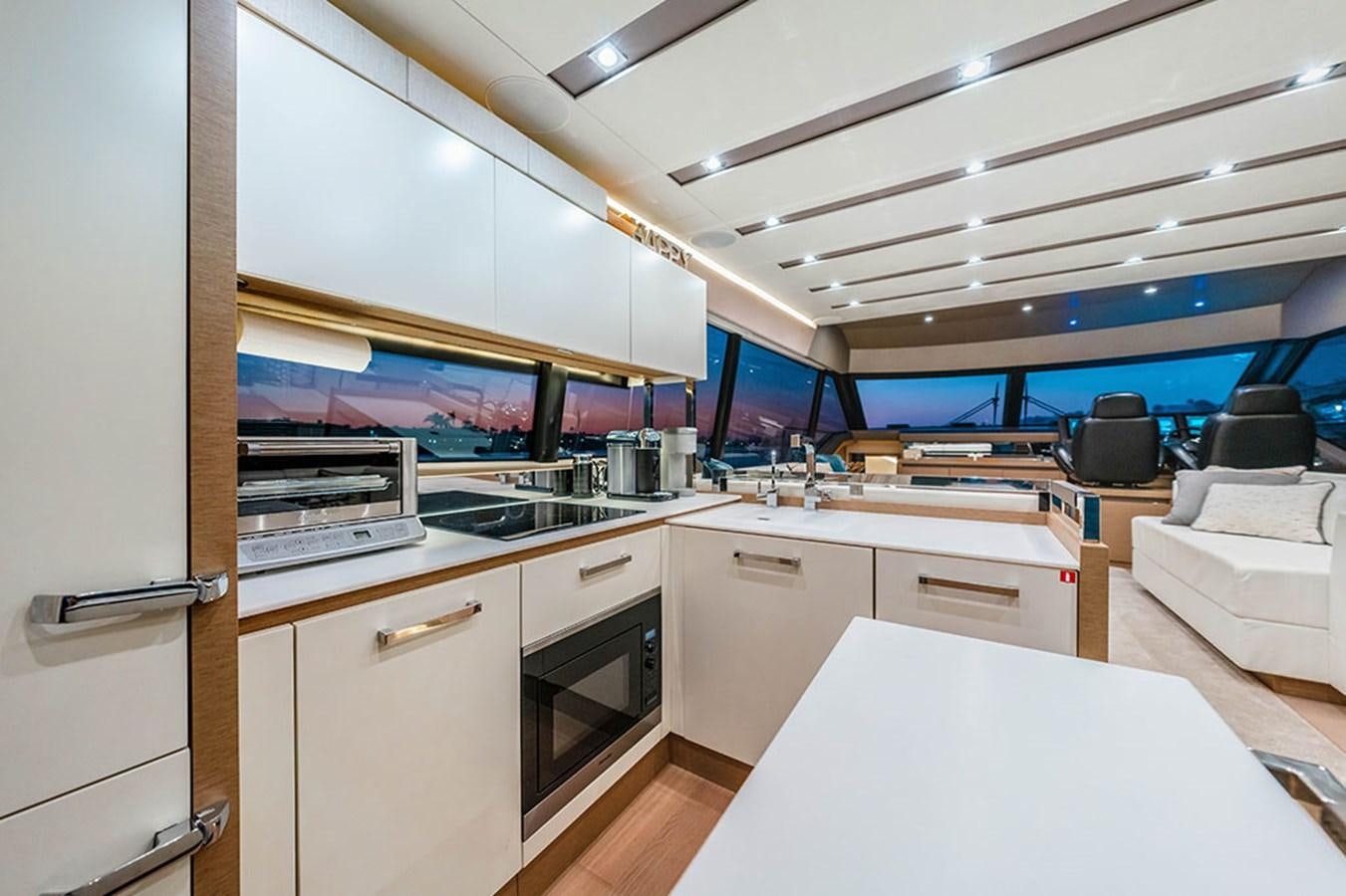 a kitchen with a large window aboard 2018 PRESTIGE 680 Yacht for Sale