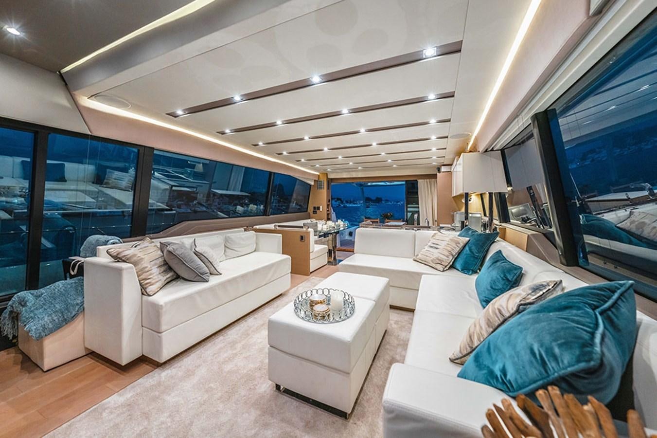 a living room with a large window aboard 2018 PRESTIGE 680 Yacht for Sale