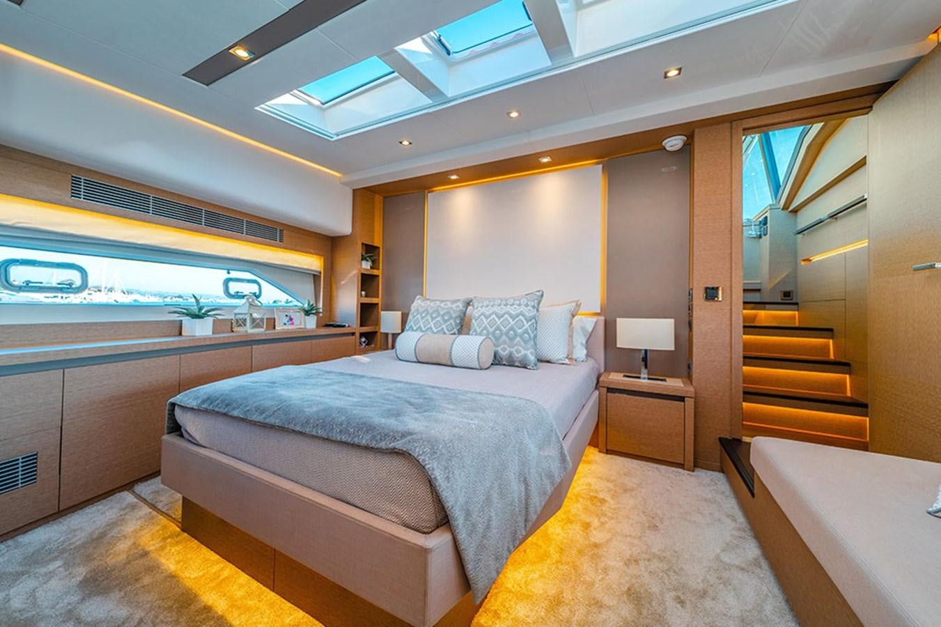 a room with a bed and a window aboard 2018 PRESTIGE 680 Yacht for Sale