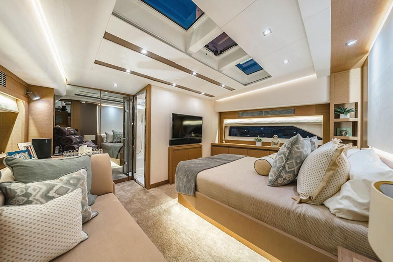 a large bedroom with a bed aboard 2018 PRESTIGE 680 Yacht for Sale