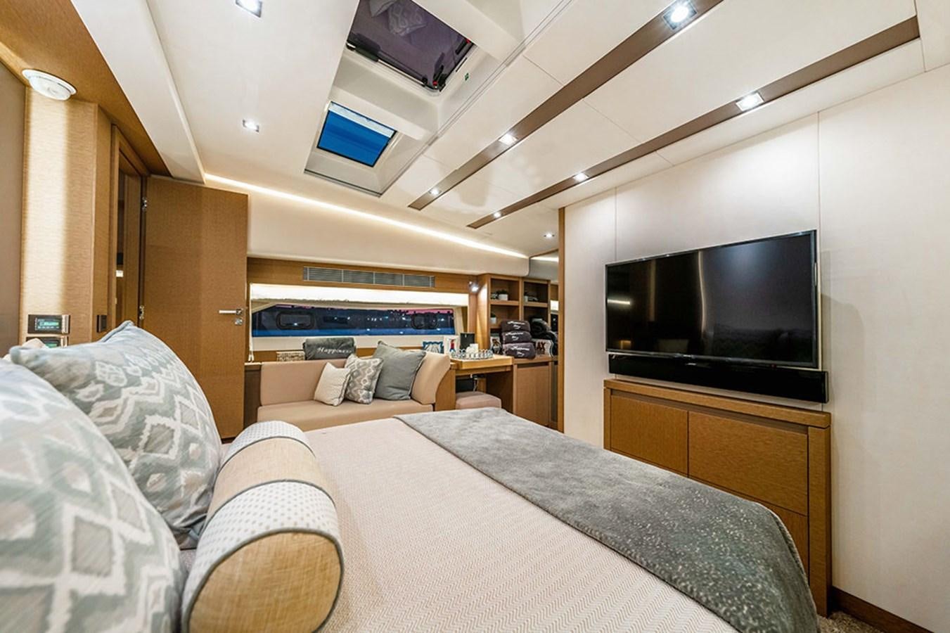 a bedroom with a bed and a tv aboard 2018 PRESTIGE 680 Yacht for Sale