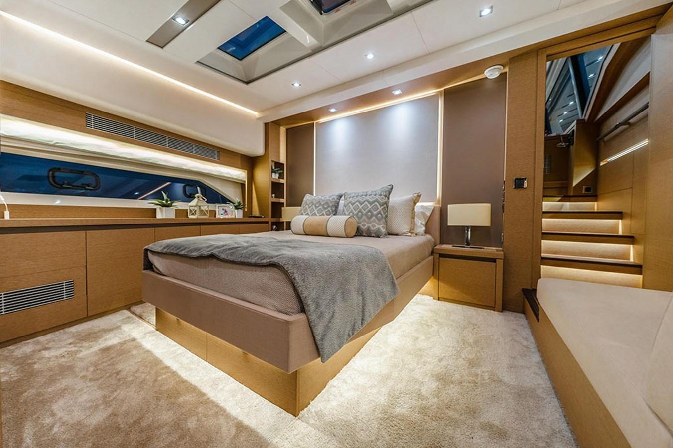 a large bedroom with a bed aboard 2018 PRESTIGE 680 Yacht for Sale