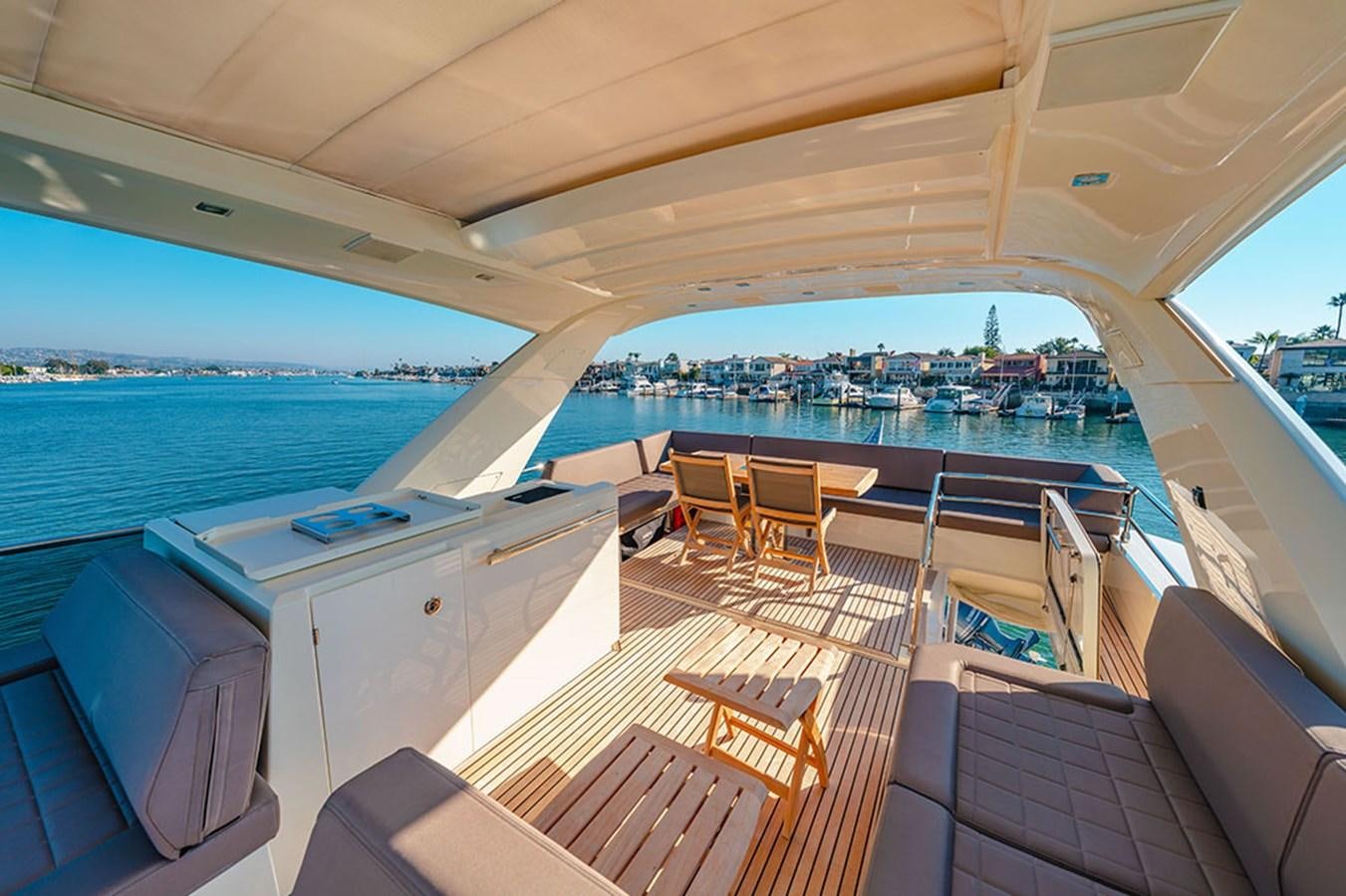 a boat with a deck and chairs aboard 2018 PRESTIGE 680 Yacht for Sale