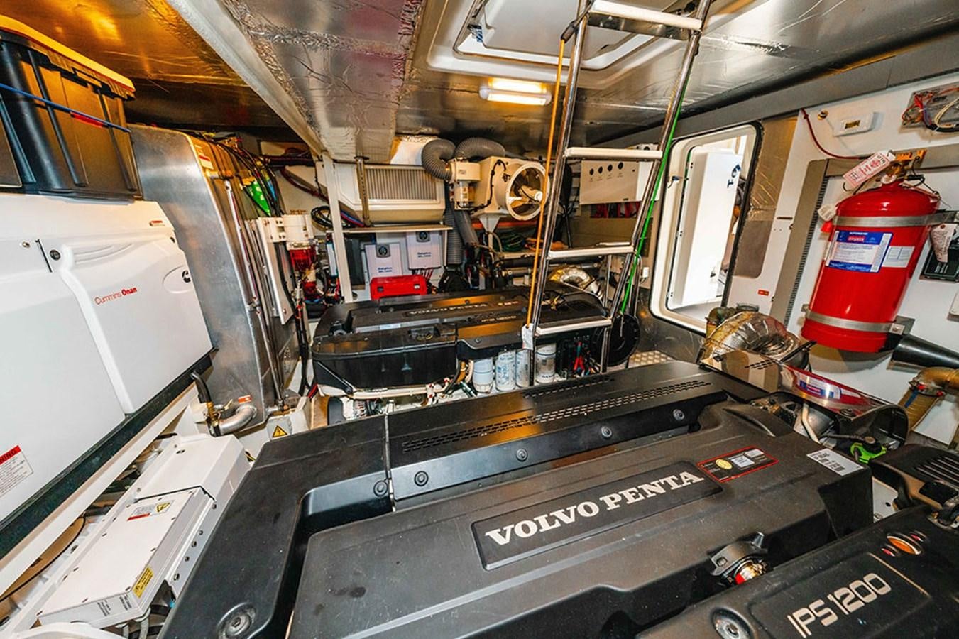 a large machine with a red bucket aboard 2018 PRESTIGE 680 Yacht for Sale