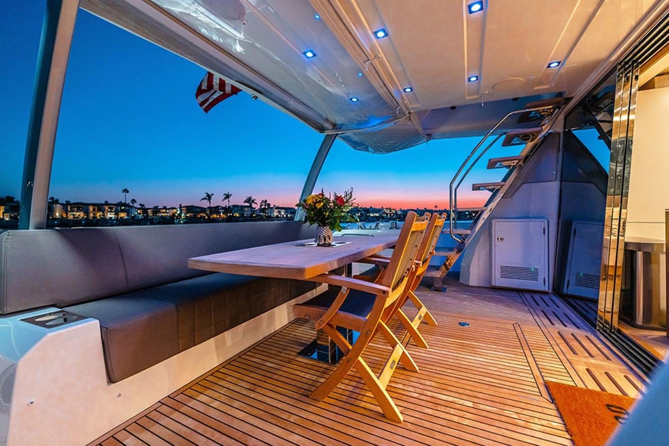 a room with a table and chairs aboard 2018 PRESTIGE 680 Yacht for Sale