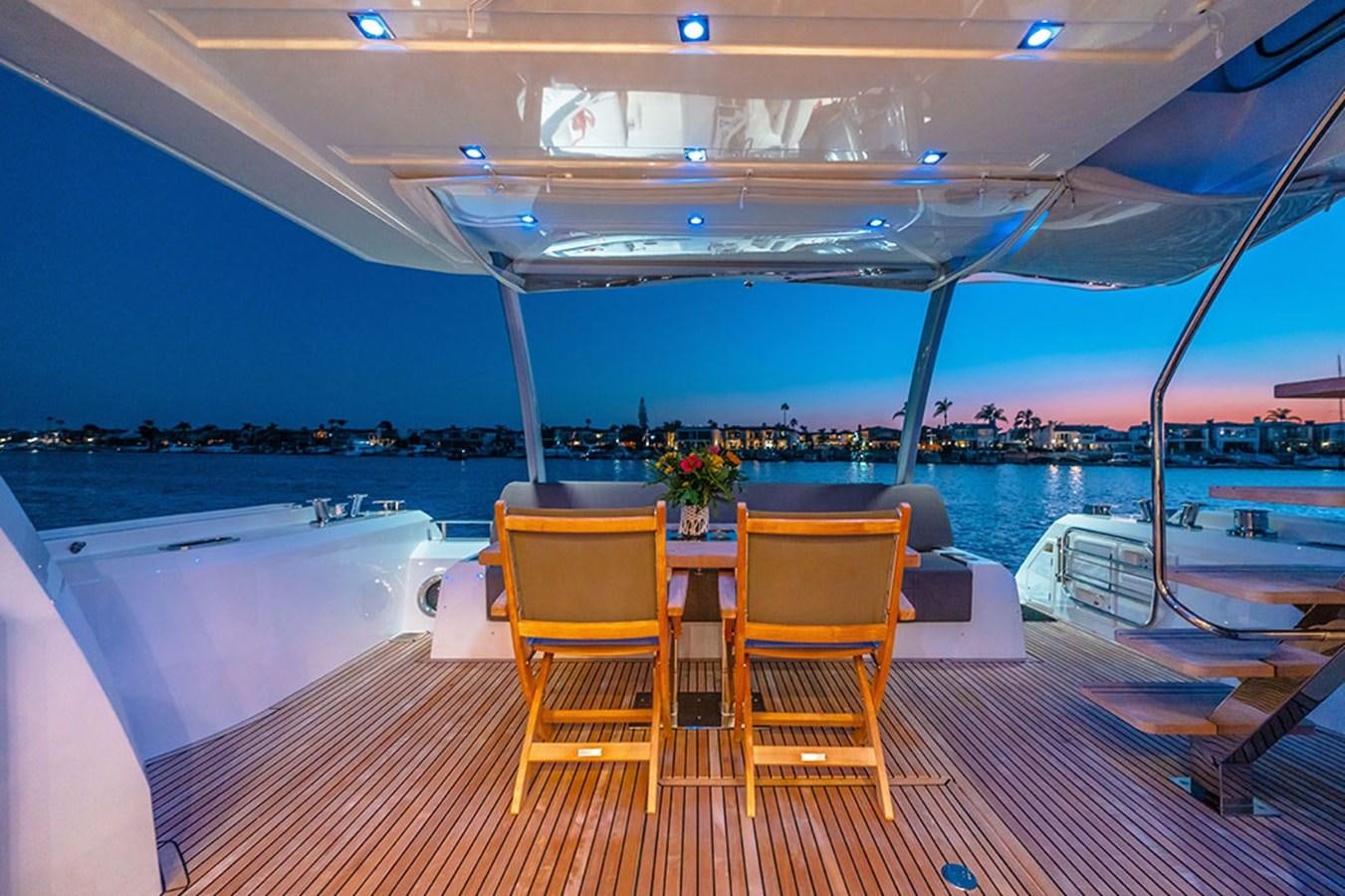 a table and chairs on a boat aboard 2018 PRESTIGE 680 Yacht for Sale