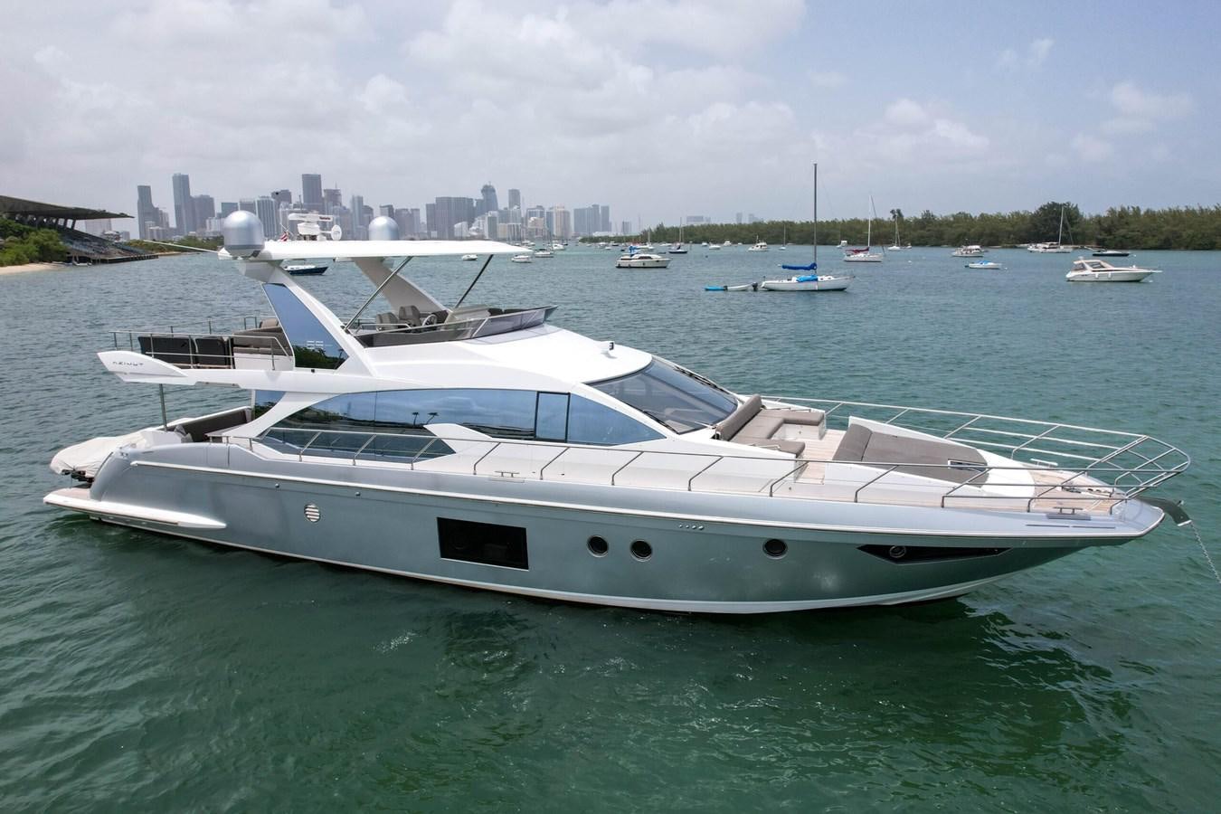 a white yacht in the water aboard 2017 66' AZIMUT Yacht for Sale