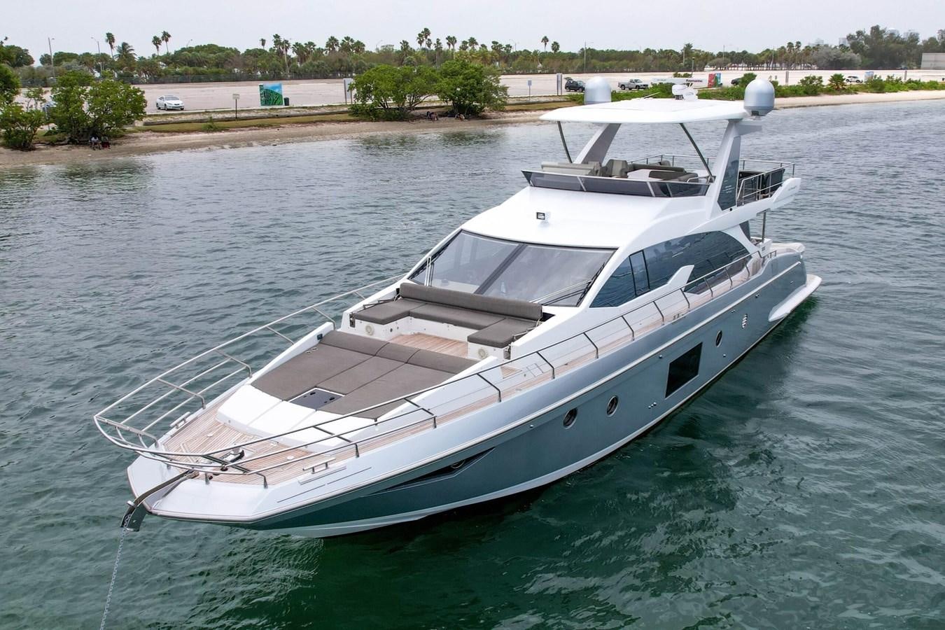 a white boat on the water aboard 2017 66' AZIMUT Yacht for Sale