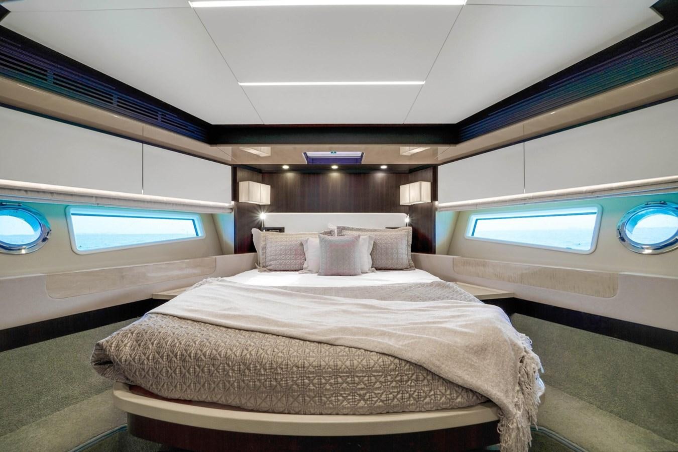 a bed in a room aboard 2017 66' AZIMUT Yacht for Sale