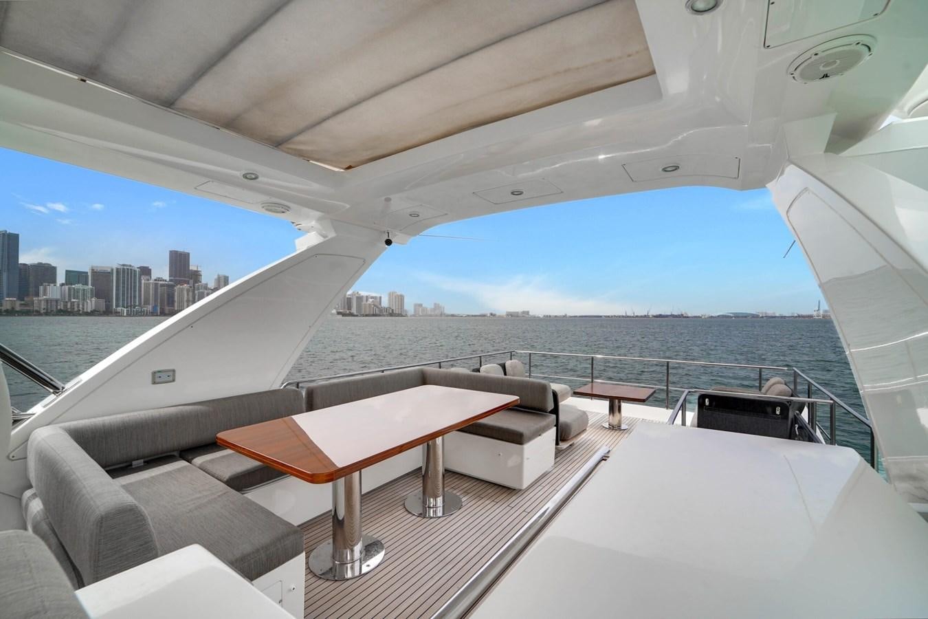 a room with a view of a city and a large body of water aboard 2017 66' AZIMUT Yacht for Sale