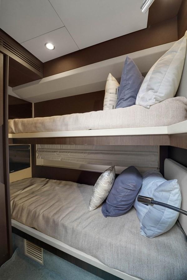 a bed with pillows aboard 2017 66' AZIMUT Yacht for Sale