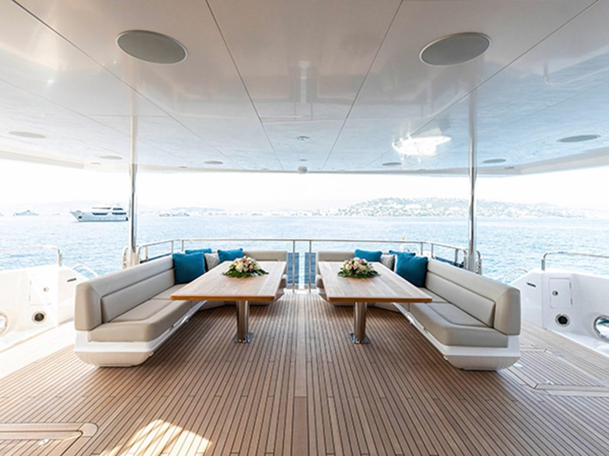 a room with a table and chairs aboard ELYSIUM Yacht for Sale