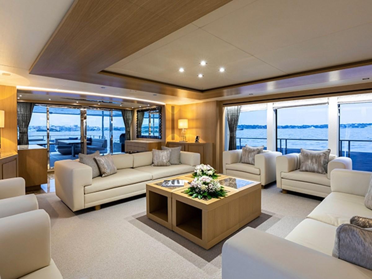 a living room with a large window aboard ELYSIUM Yacht for Sale