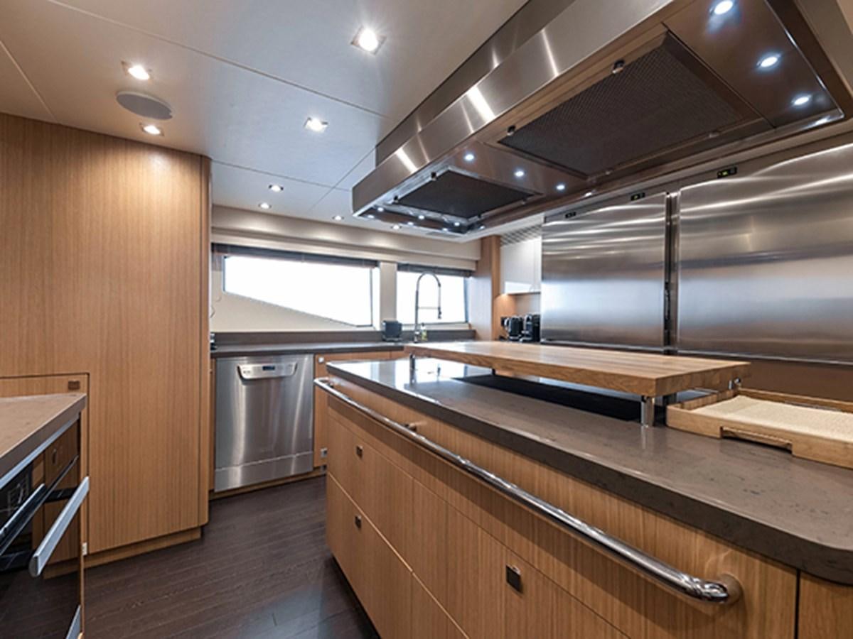 a kitchen with wooden cabinets aboard ELYSIUM Yacht for Sale