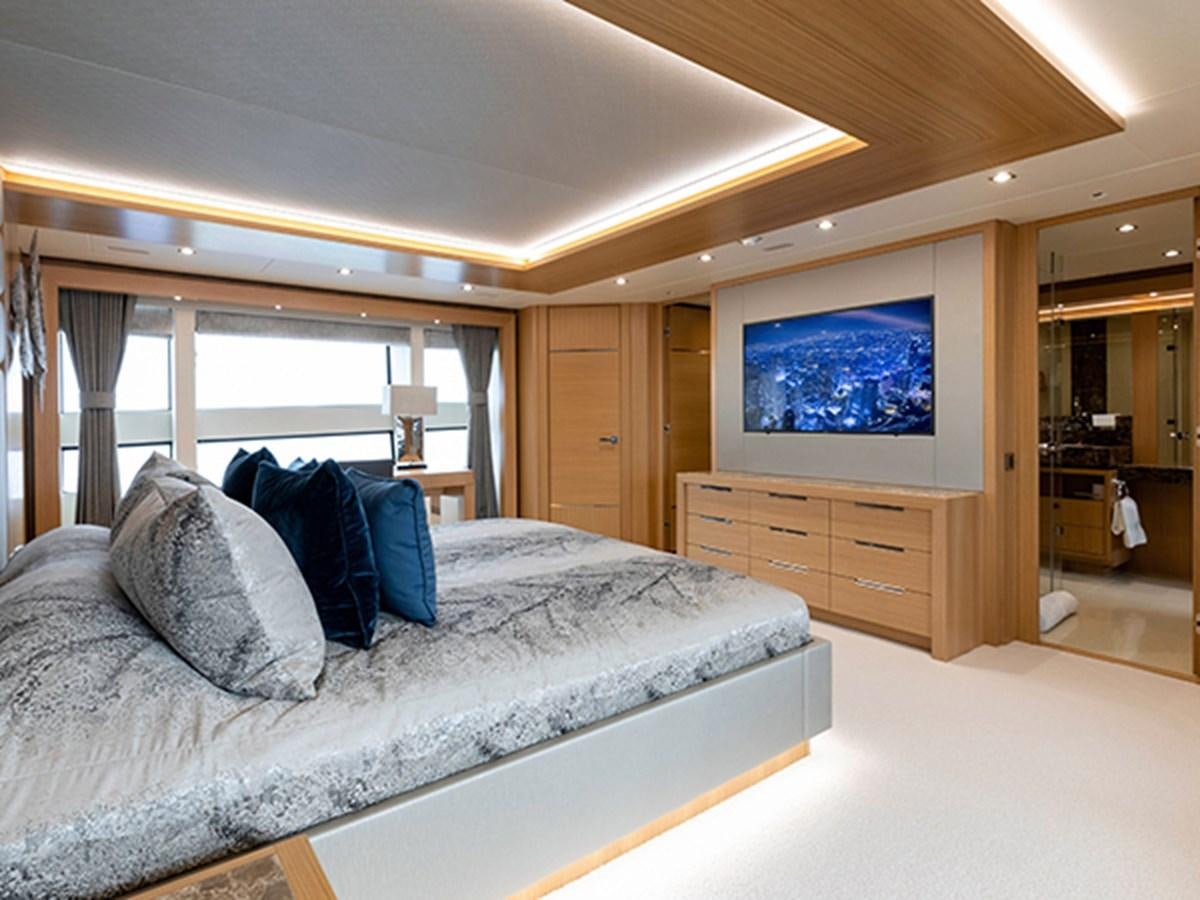 a bed in a room aboard ELYSIUM Yacht for Sale