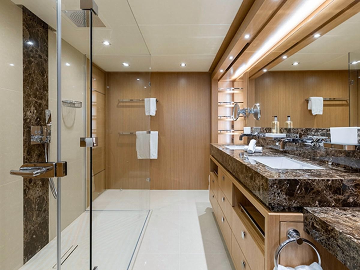 a bathroom with a large mirror aboard ELYSIUM Yacht for Sale