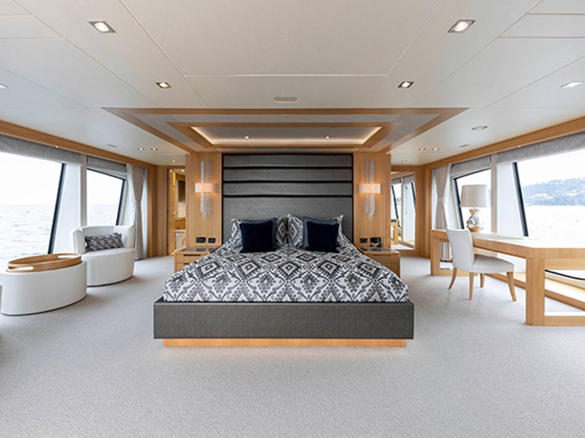 a large bed in a room aboard ELYSIUM Yacht for Sale