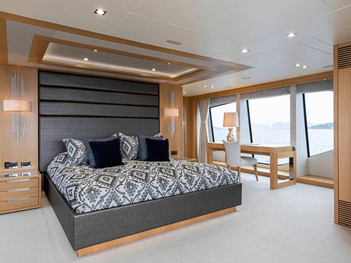 a large bed in a room aboard ELYSIUM Yacht for Sale