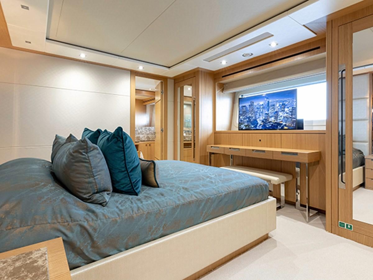 a bed in a room aboard ELYSIUM Yacht for Sale