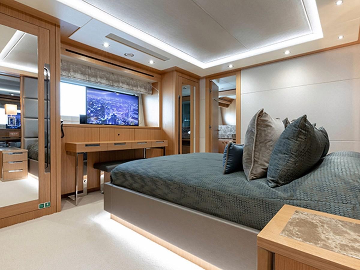 a bed in a room aboard ELYSIUM Yacht for Sale
