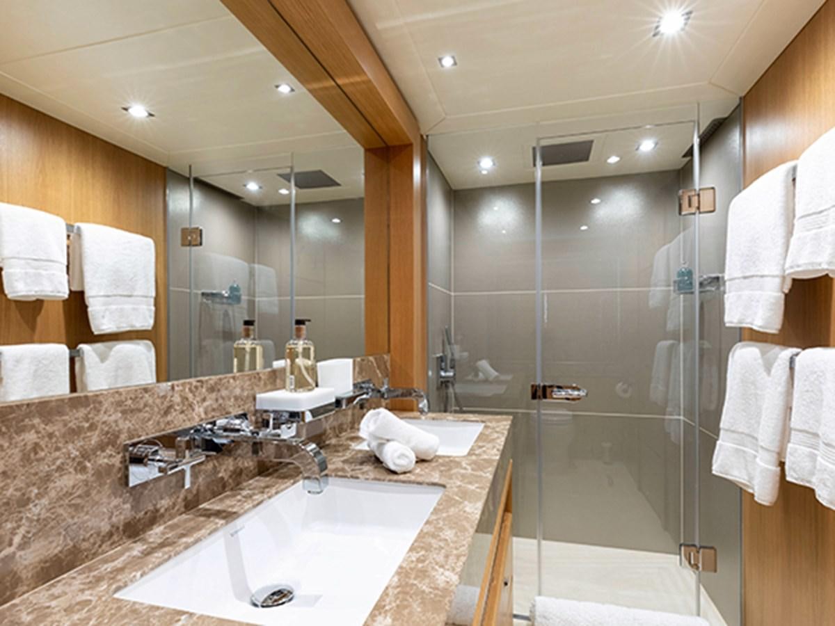 a bathroom with a large glass shower aboard ELYSIUM Yacht for Sale