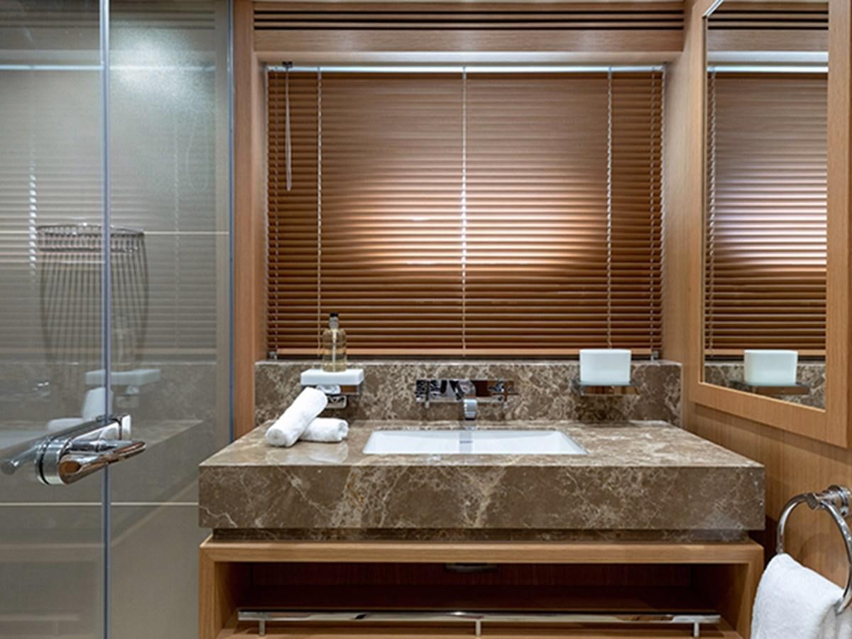 a bathroom with a countertop sink aboard ELYSIUM Yacht for Sale