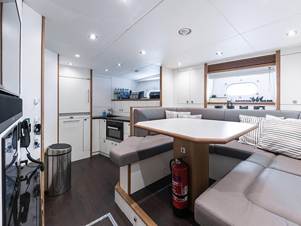 a kitchen and living room aboard ELYSIUM Yacht for Sale