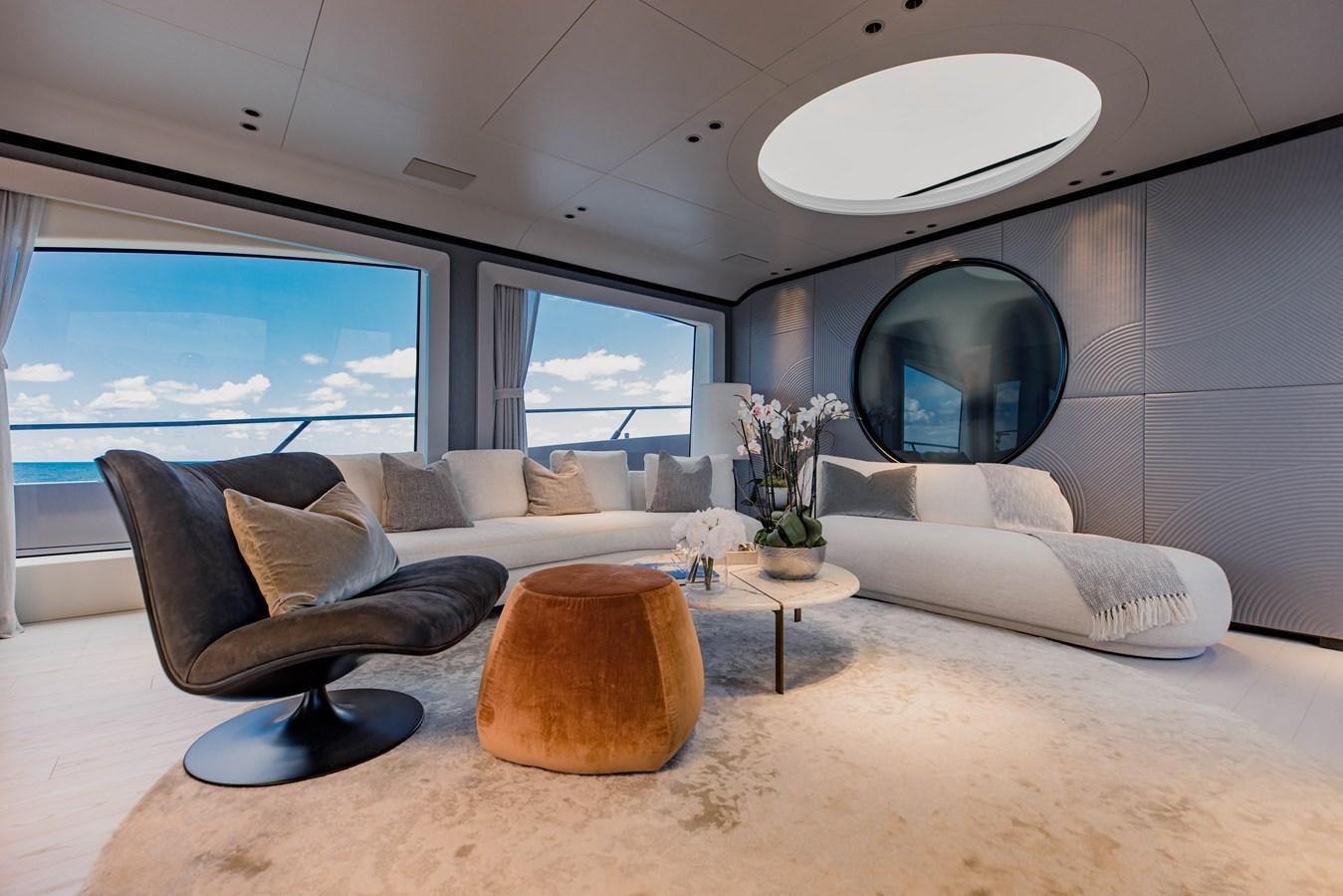 a living room with a large mirror aboard OFFLINE Yacht for Sale