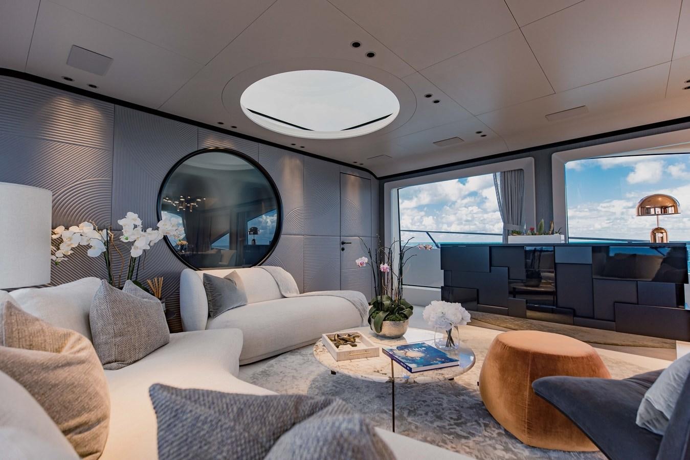 a living room with a large window aboard OFFLINE Yacht for Sale