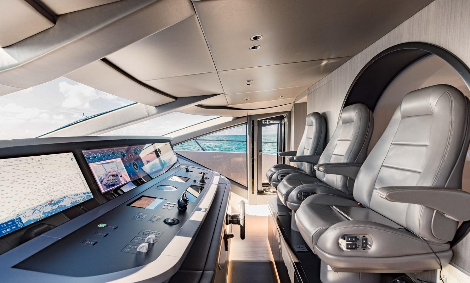 inside of a vehicle with a large screen and a large window aboard OFFLINE Yacht for Sale