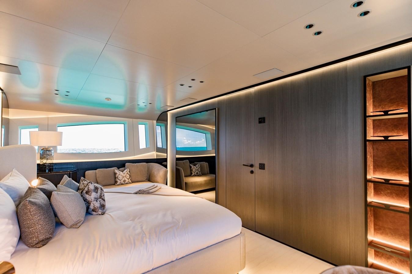 a bedroom with a bed and a mirror aboard OFFLINE Yacht for Sale