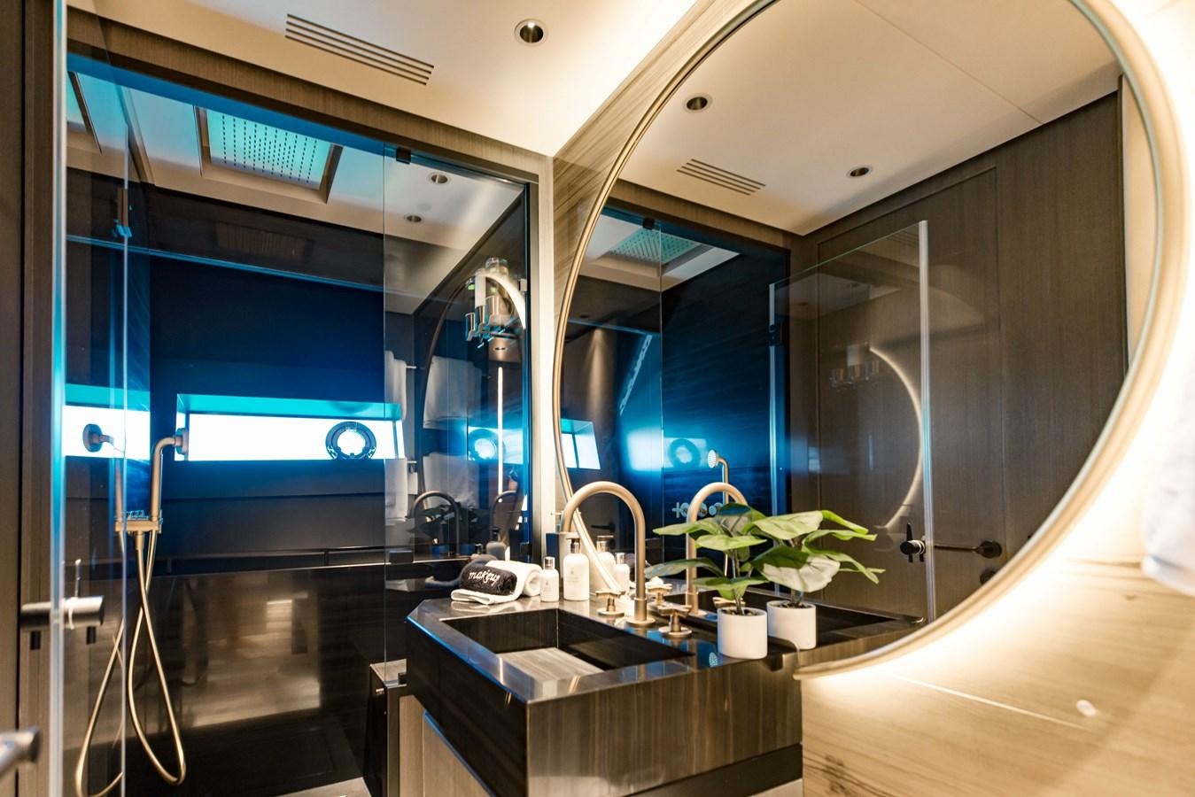a bathroom with a large mirror aboard OFFLINE Yacht for Sale