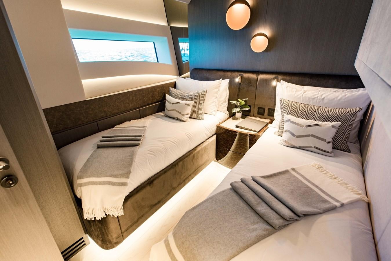 a room with two beds aboard OFFLINE Yacht for Sale